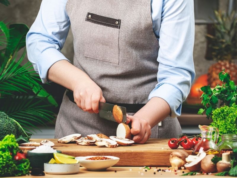 Chef chopping fresh vegetables
